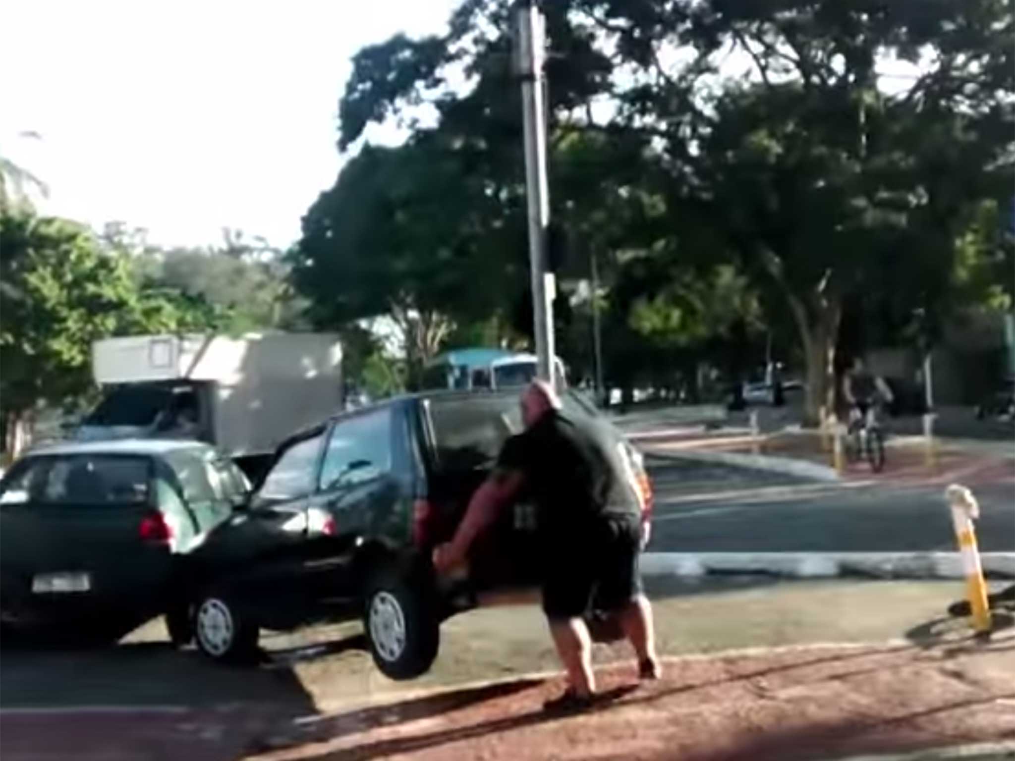 This cyclist was not happy with a car blocking his path