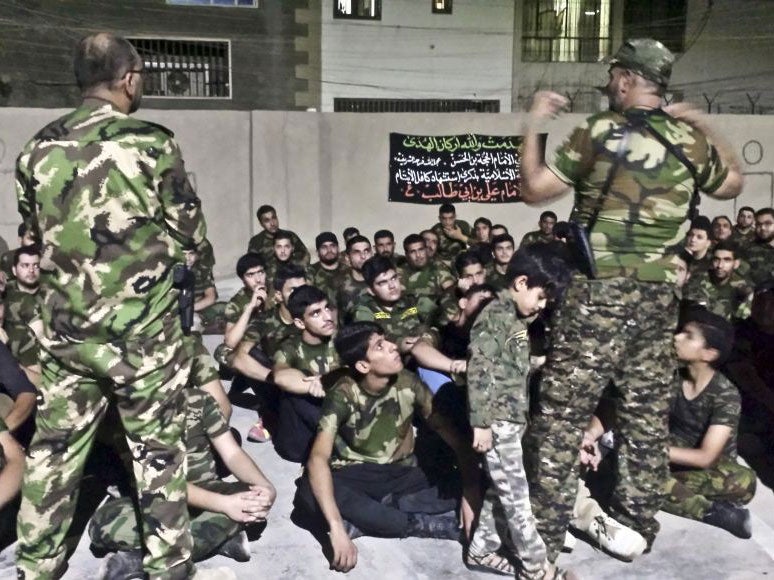 &#13;
Young Iraqi volunteers were photographed training with the Popular Mobilisation Forces in Baghdad, Iraq. &#13;