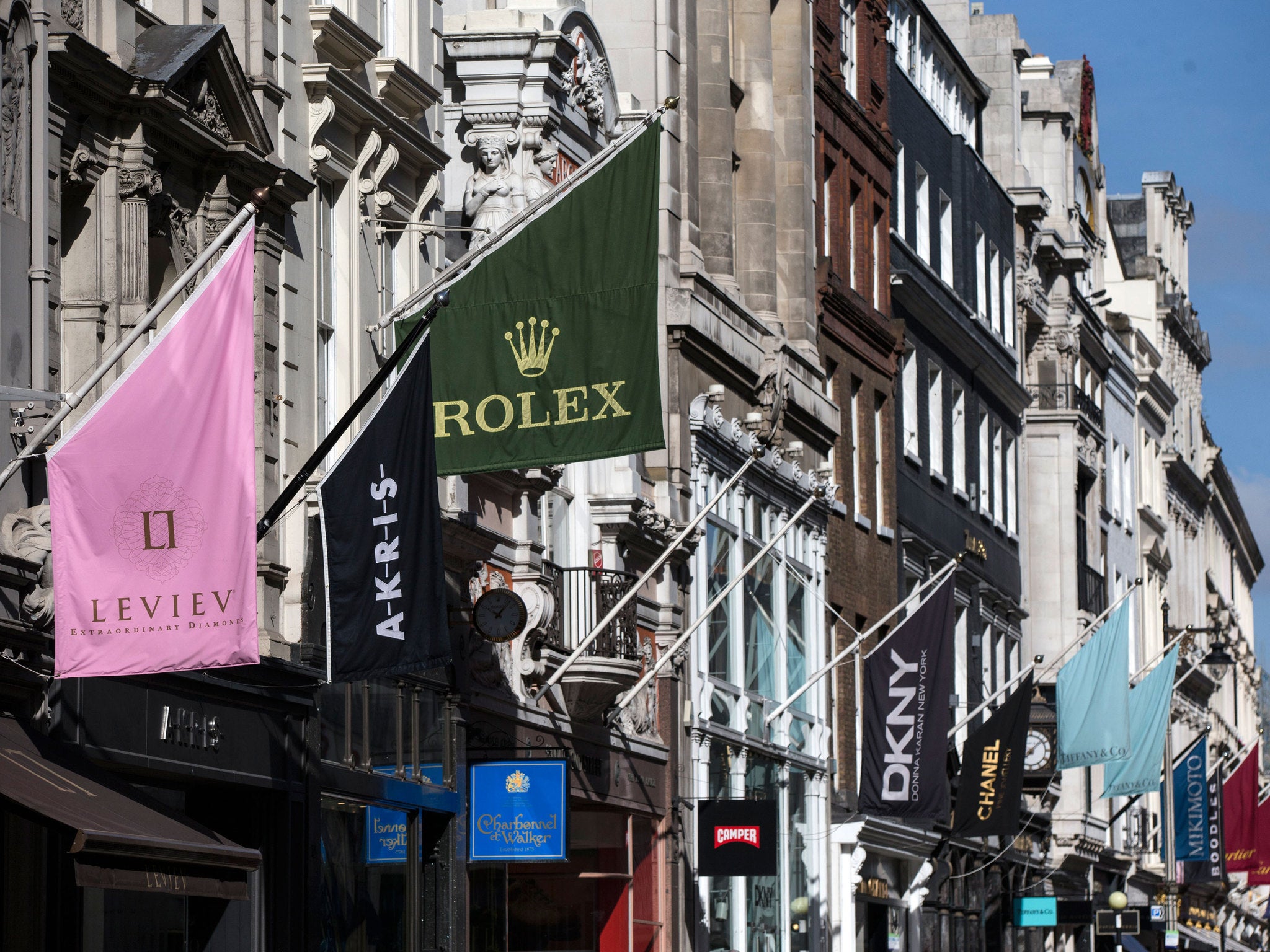Luxury goods shops line Old Bond Street in Central London