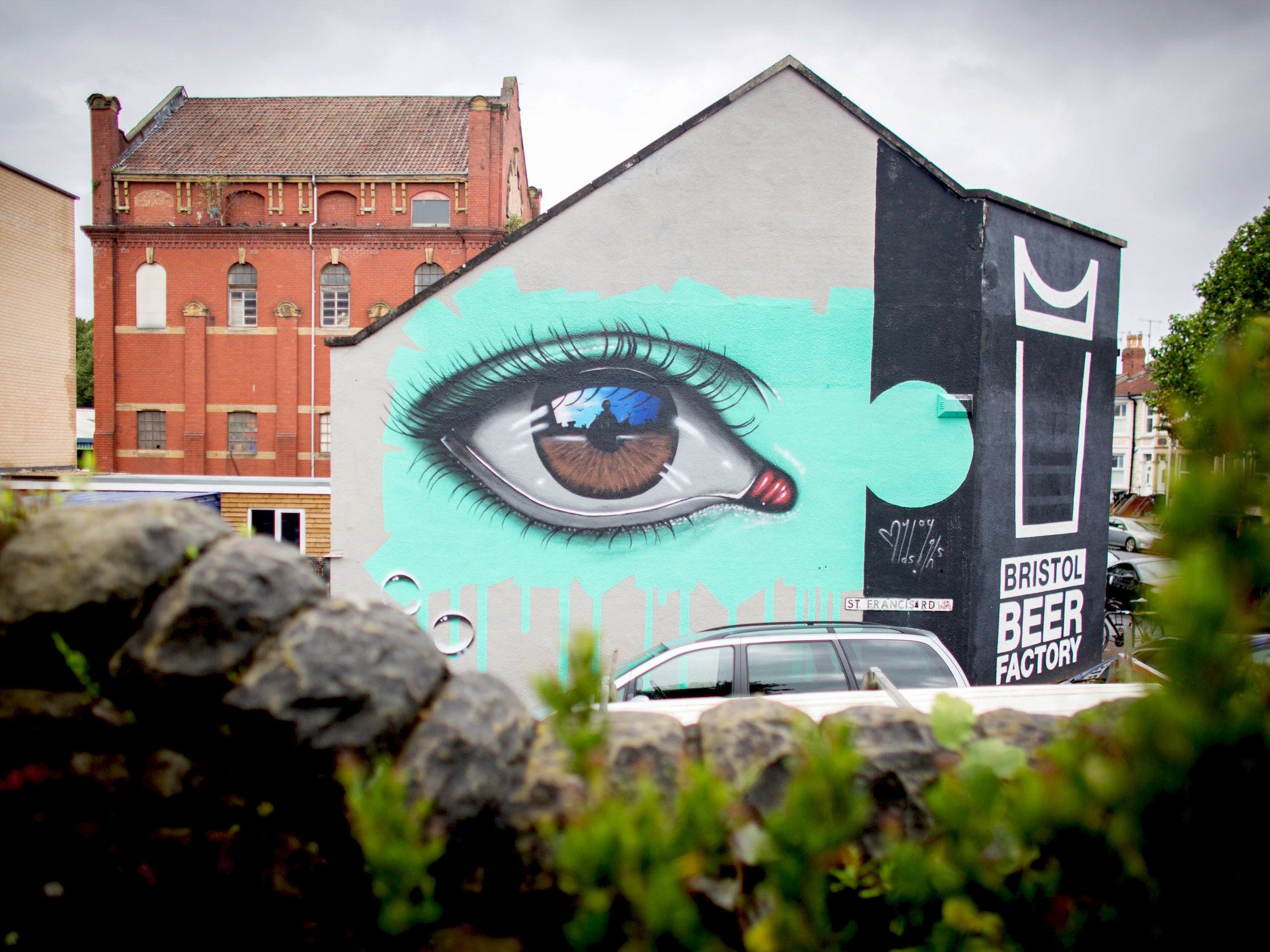 Mural by My Dog Sighs is seen on the side of the Bristol Beer Factory