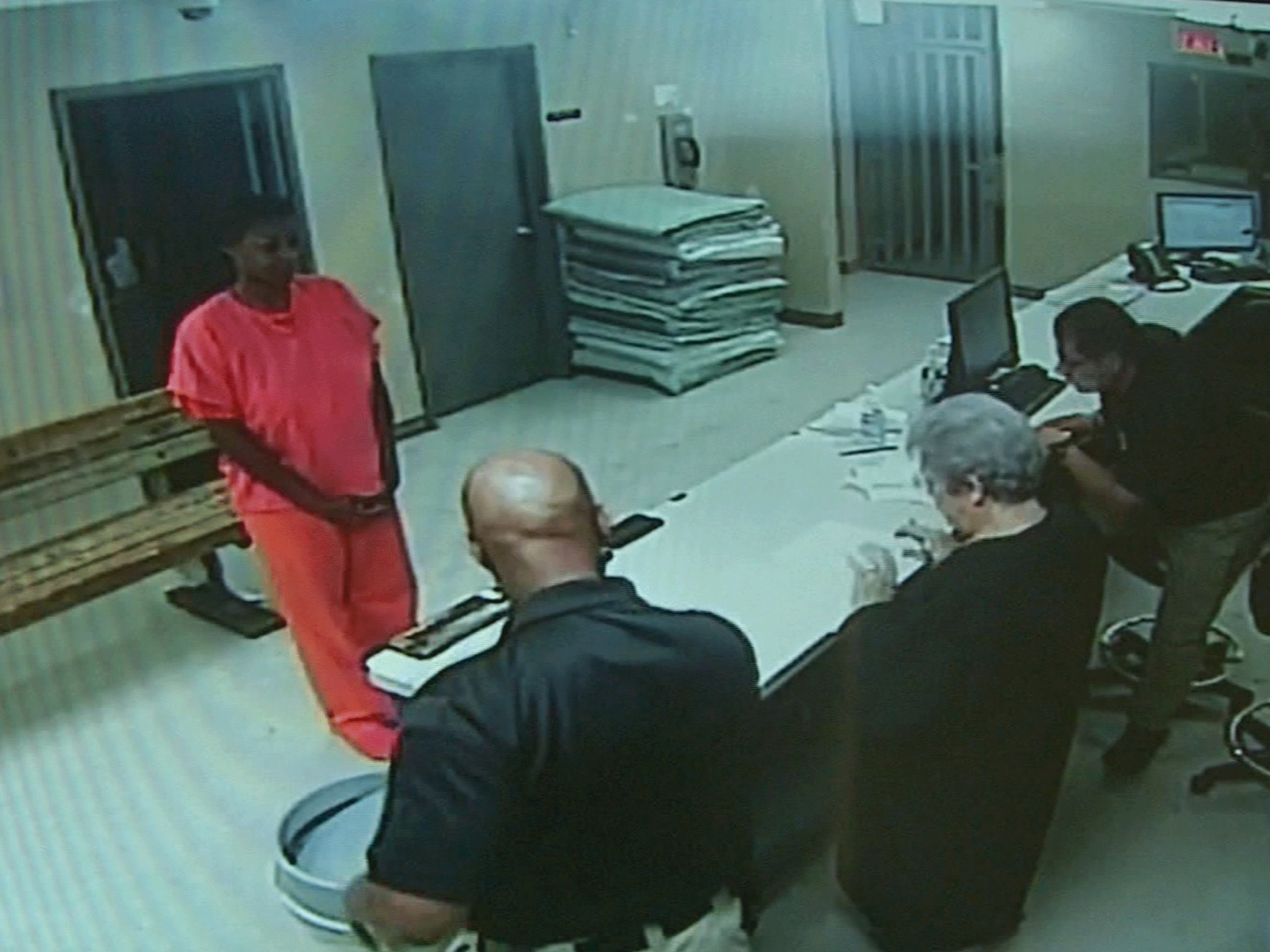 In this undated frame from video provided by the Waller County Sheriff's Department, Sandra Bland stands before a desk at Waller County Jail in Hempstead, Texas
