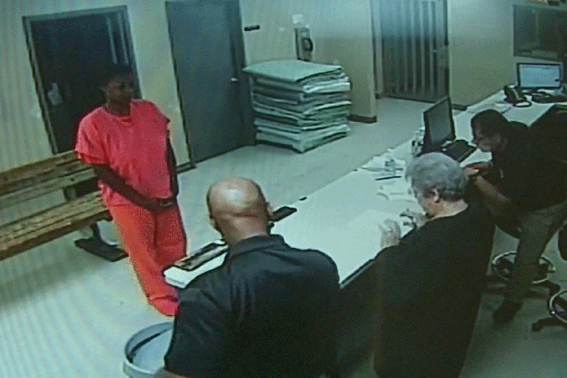 In this undated frame from video provided by the Waller County Sheriff's Department, Sandra Bland stands before a desk at Waller County Jail in Hempstead, Texas