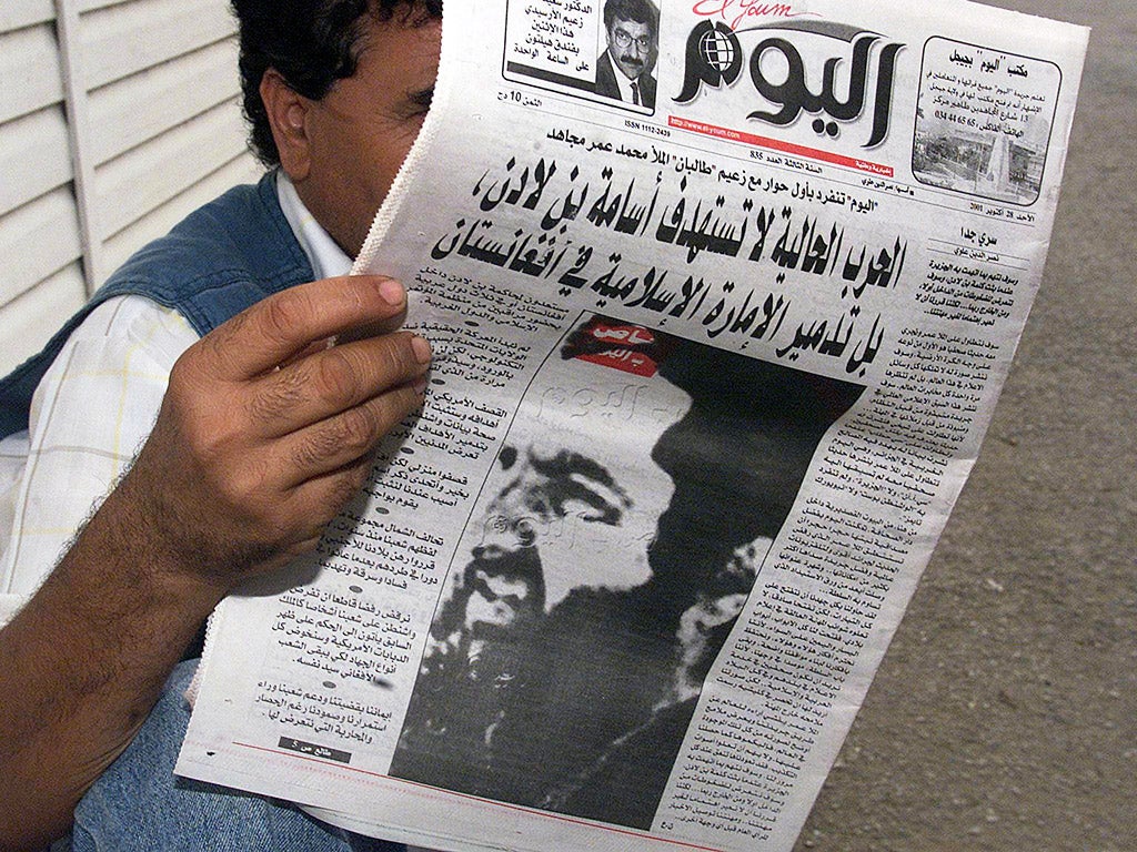Mullah Omar, pictured on the front of an Algerian newspaper in 2001 (Getty)
