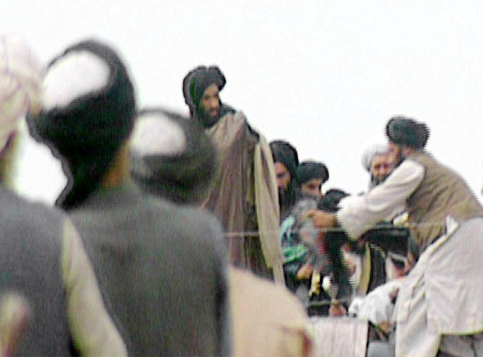 Footage from a 1996 ‘Newsnight’ film shows the Afghan Taliban’s leader Mullah Mohammed Omar (centre) during a rally for his troops in Kandahar