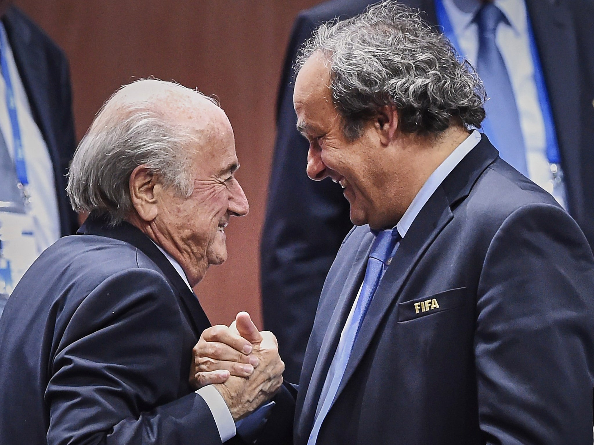 Sepp Blatter is congratulated by Michel Platini after being re-elected Fifa president in May