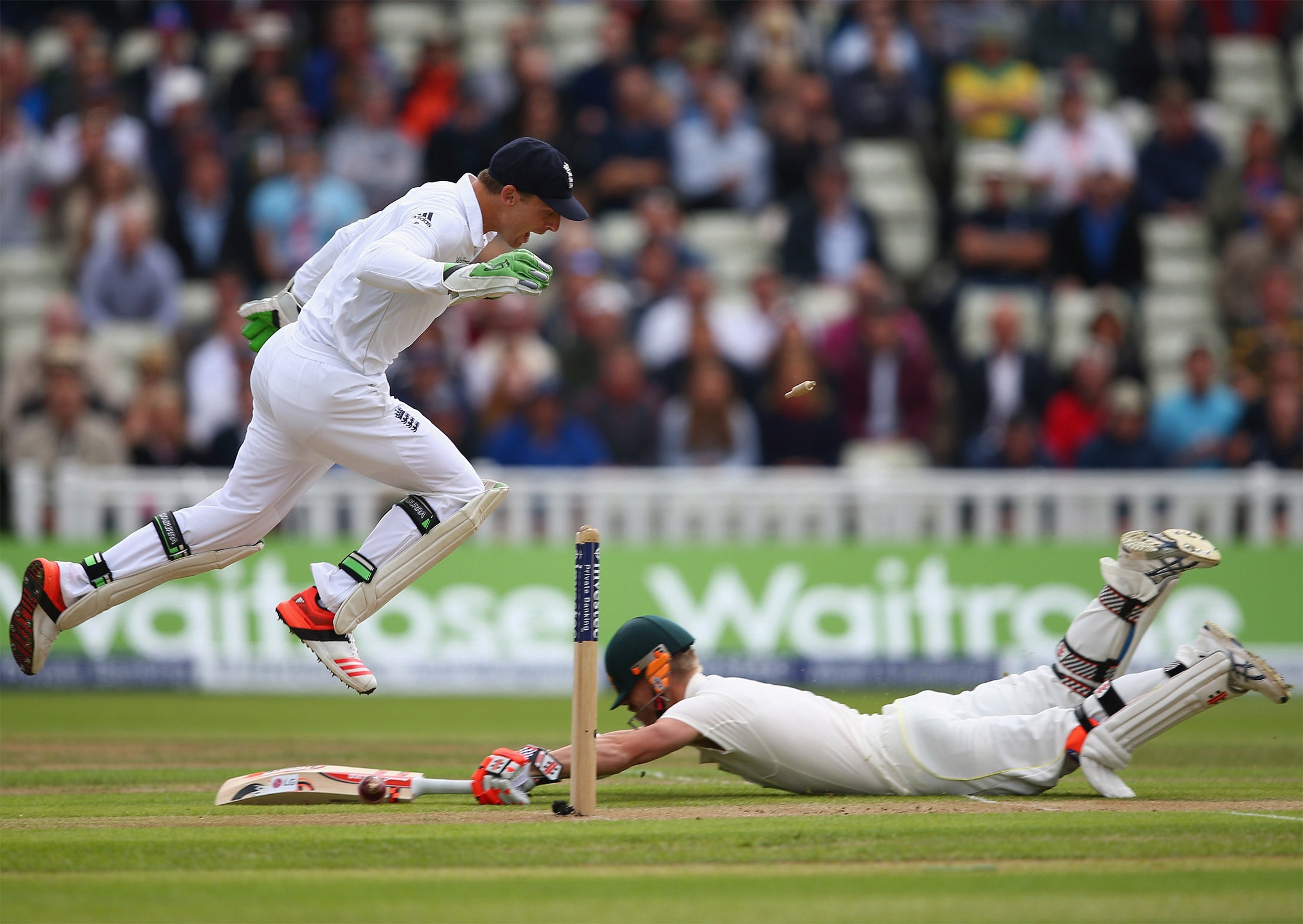 David Warner survives a scare in the first over from Jimmy Anderson, scrambling for his ground after a Stuart Broad throw knocks down the stumps (Getty)