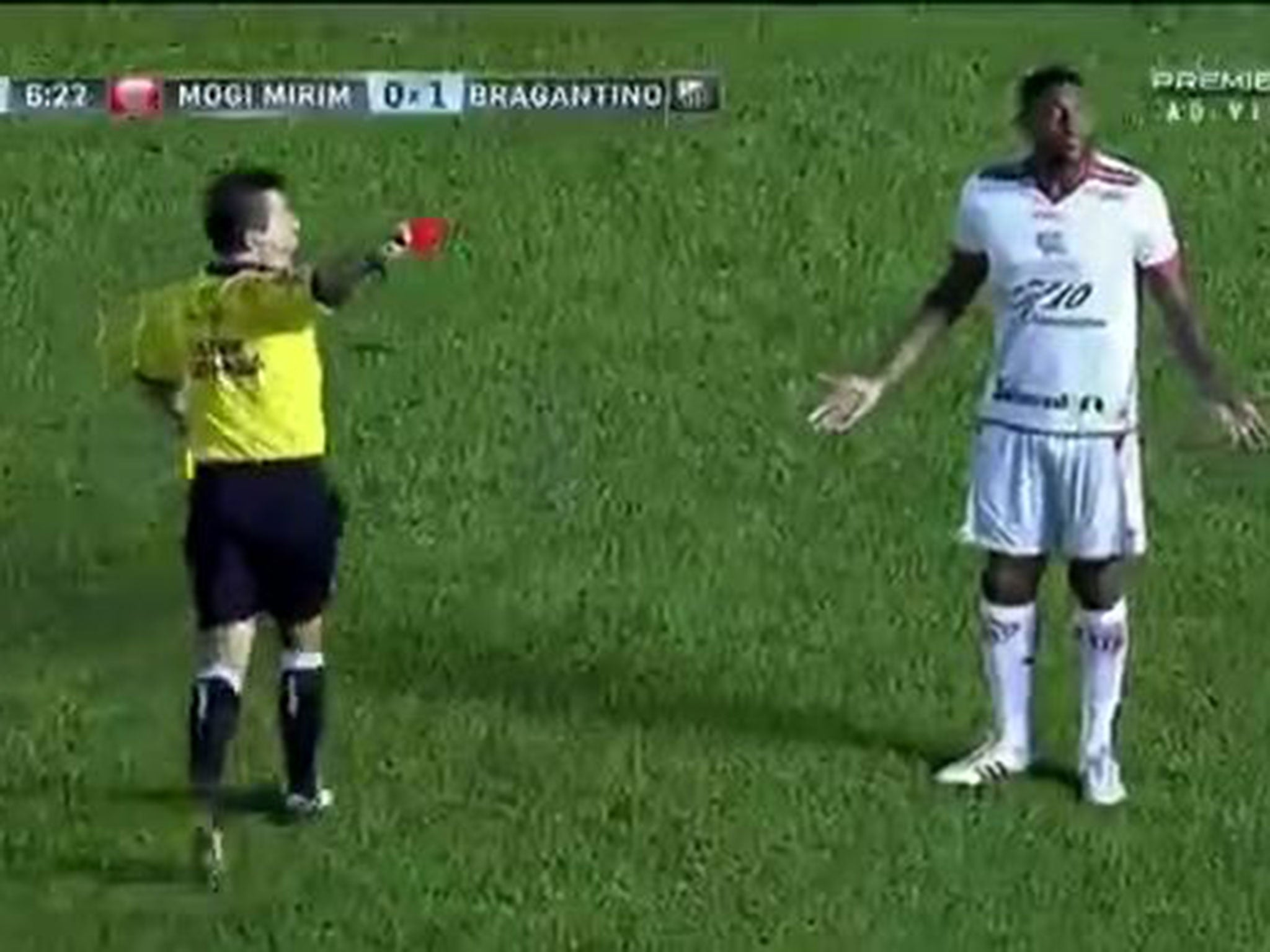 Paulao is shown a red card, much to his bemusement