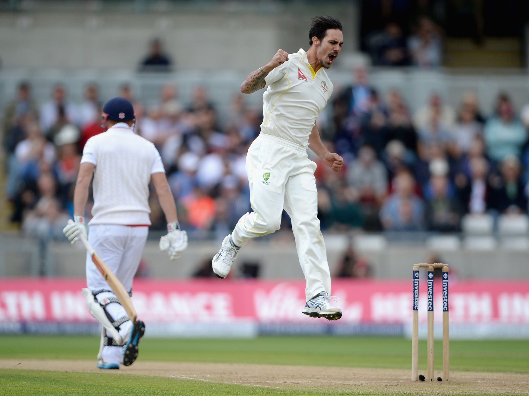 Johnson celebrates taking the wicket of Bairstow