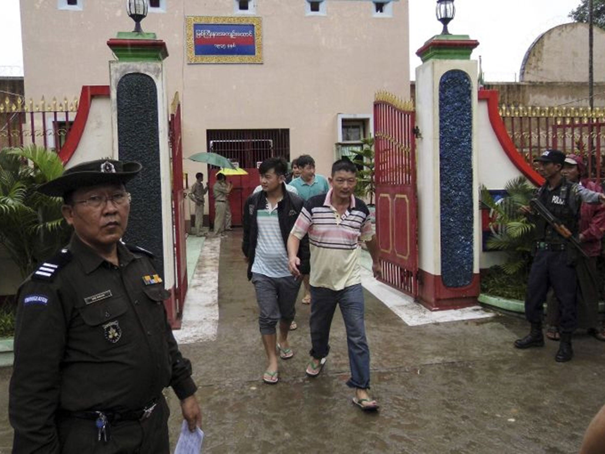 Chinese nationals, who were jailed for illegal logging, walk out of Myitkyina prison after being released during an amnesty