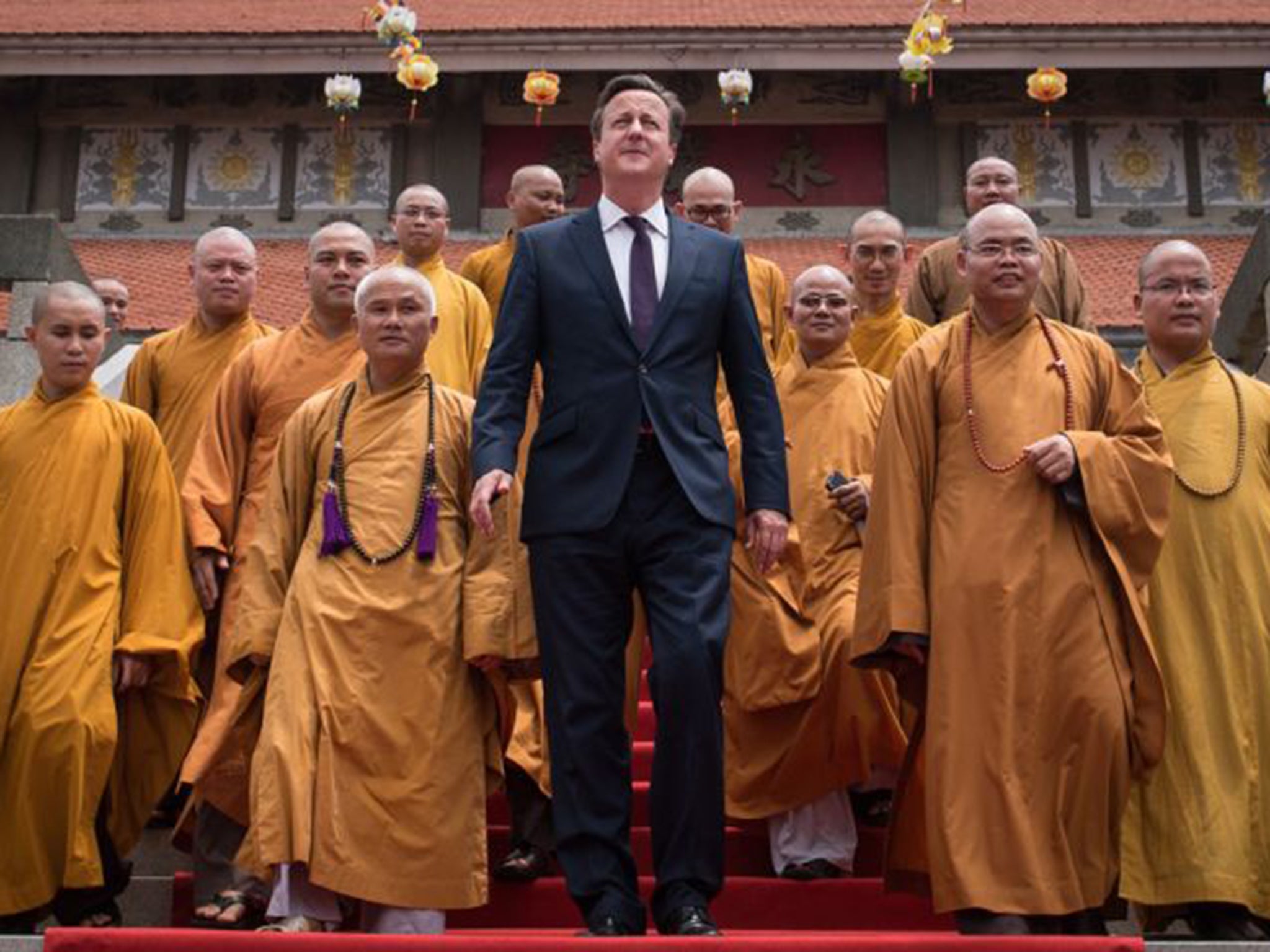 Prime Minister David Cameron is given a tour of the Vinh Nghiem Pagoda in Ho Chi Minh City by Buddhist monks on Thursday. Several MPs want Mr Cameron to set out clearer objectives before starting air strikes in Syria