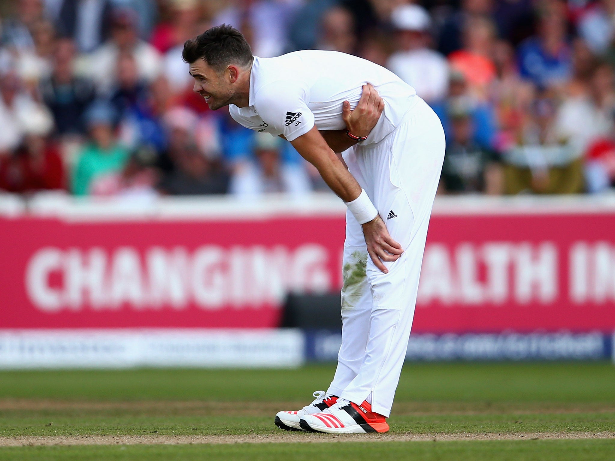 Jimmy Anderson grimaces in pain