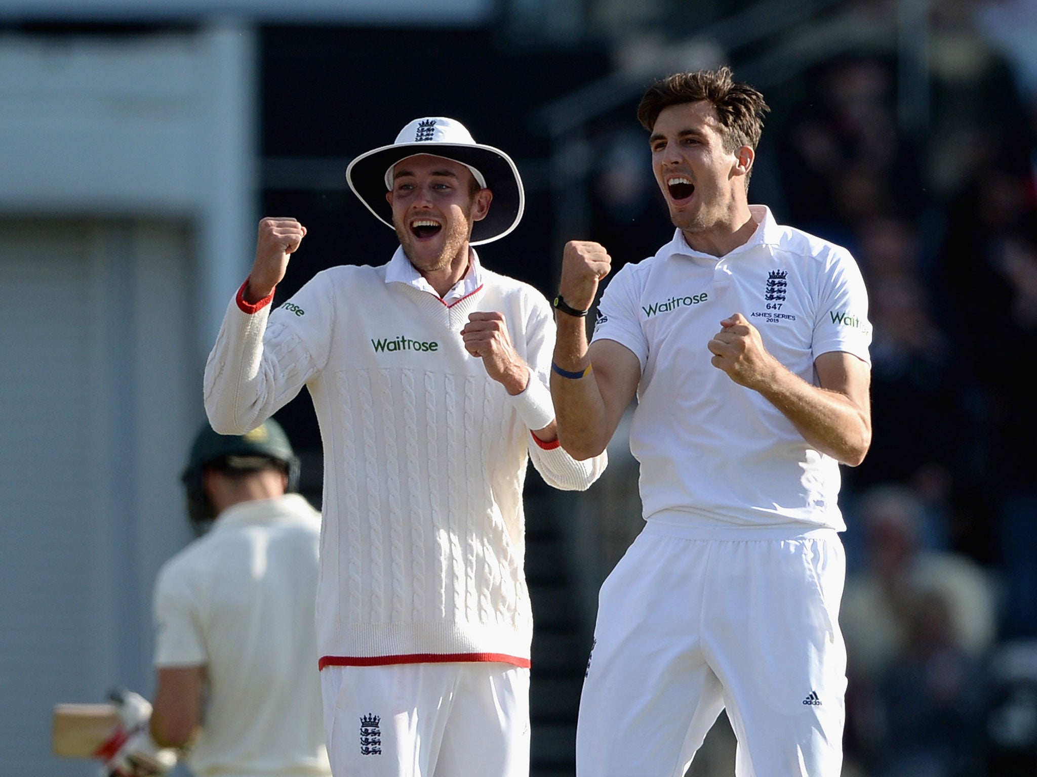 Finn (right) celebrates his wicket of Johnson with Broad