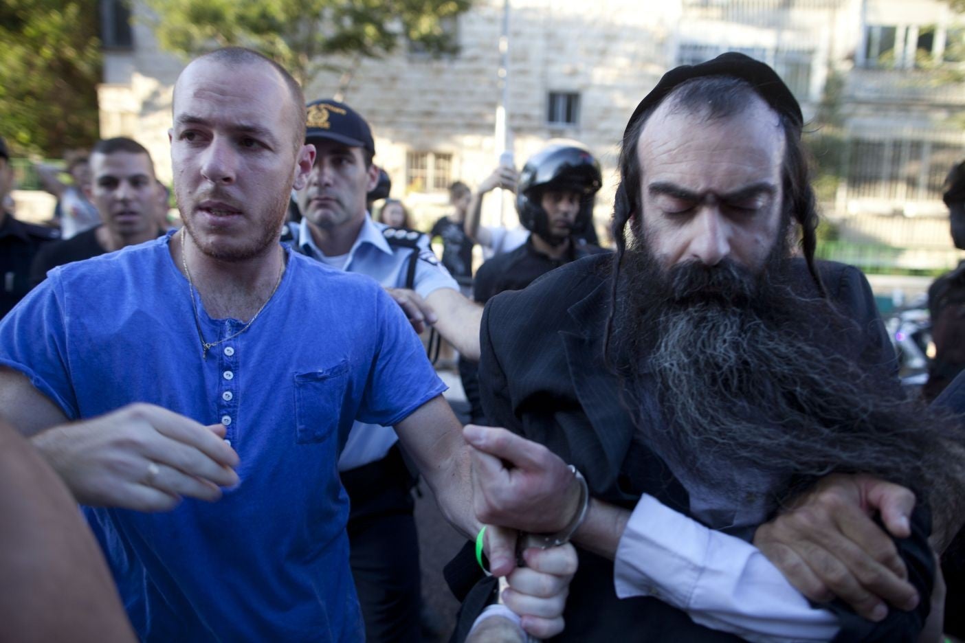 Police arrest Yishai Schlissel, after he attacked people with a knife at Jerusalem's annual pride parade