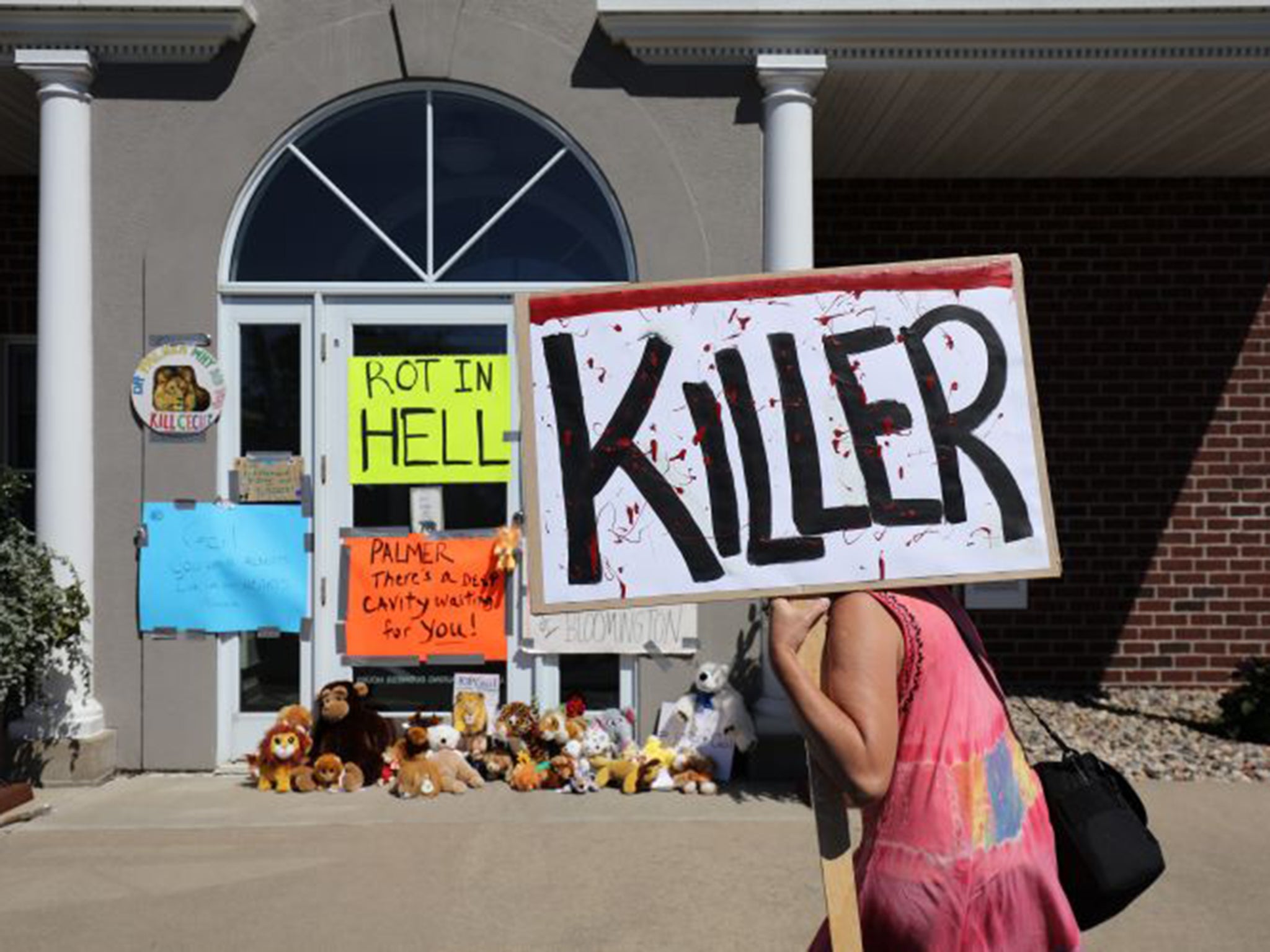 Protesters gather outside Walter Palmer’s office