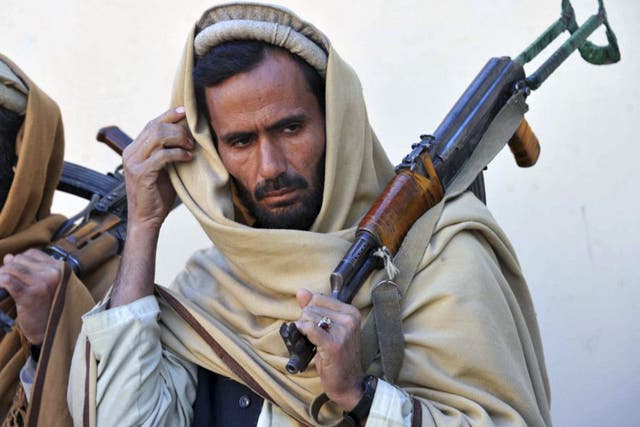 Former Taliban fighters remain well armed despite joining a peace and reconciliation process ceremony in Herat last year. Now they wait to find out if peace will be pursued
