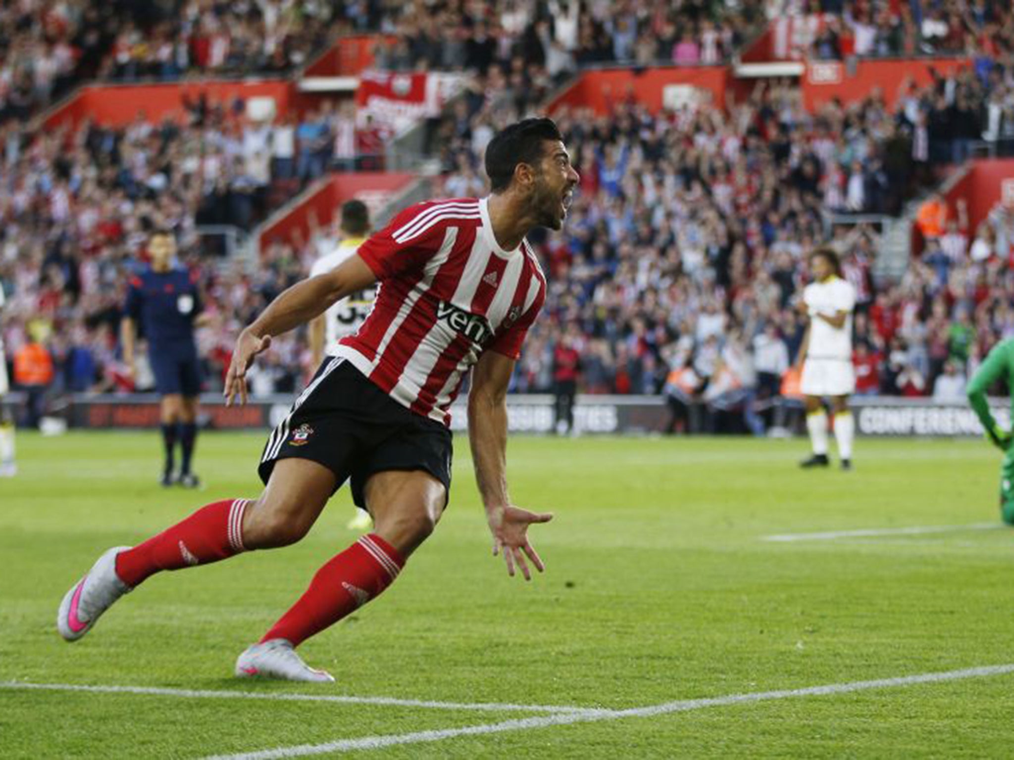 Graziano Pelle wheels away in celebration after scoring the opening goal for Southampton