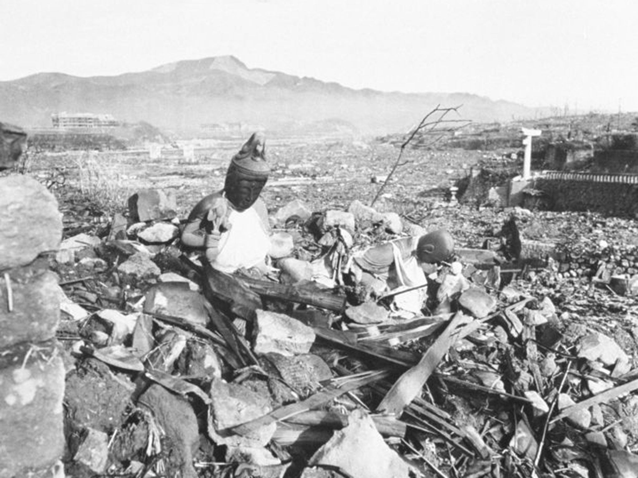 Battered religious figures stand on a hill above a tattered valley September 24, 1945 after the Americans dropped an atomic bomb in Nagasaki