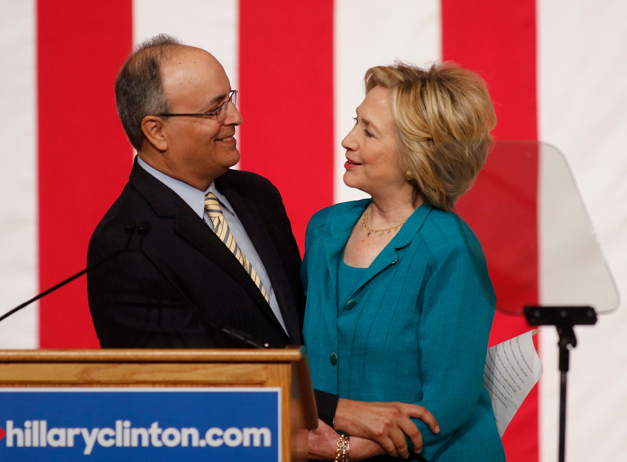 Hillary Clinton is introduced by Frank Mora, director of the Latin American and Caribbean Center at Florida International University, before her speech on Cuban relations on Friday.