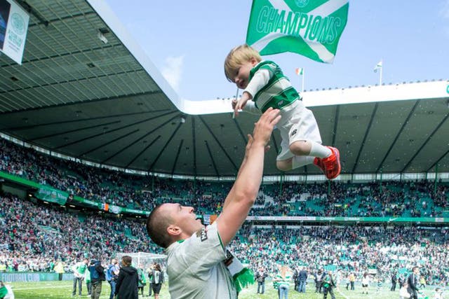 Celtic captain Scott Brown with his son Sonny after winning the Scottish Premiership Match between Celtic and Inverness Caley Thistle at Celtic Park on May 24, 2015