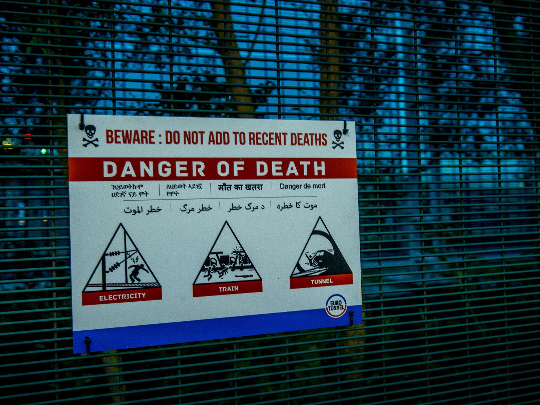 Placard reading 'Beware : danger of death' is pictured in the Eurotunnel site in Coquelles near Calais,