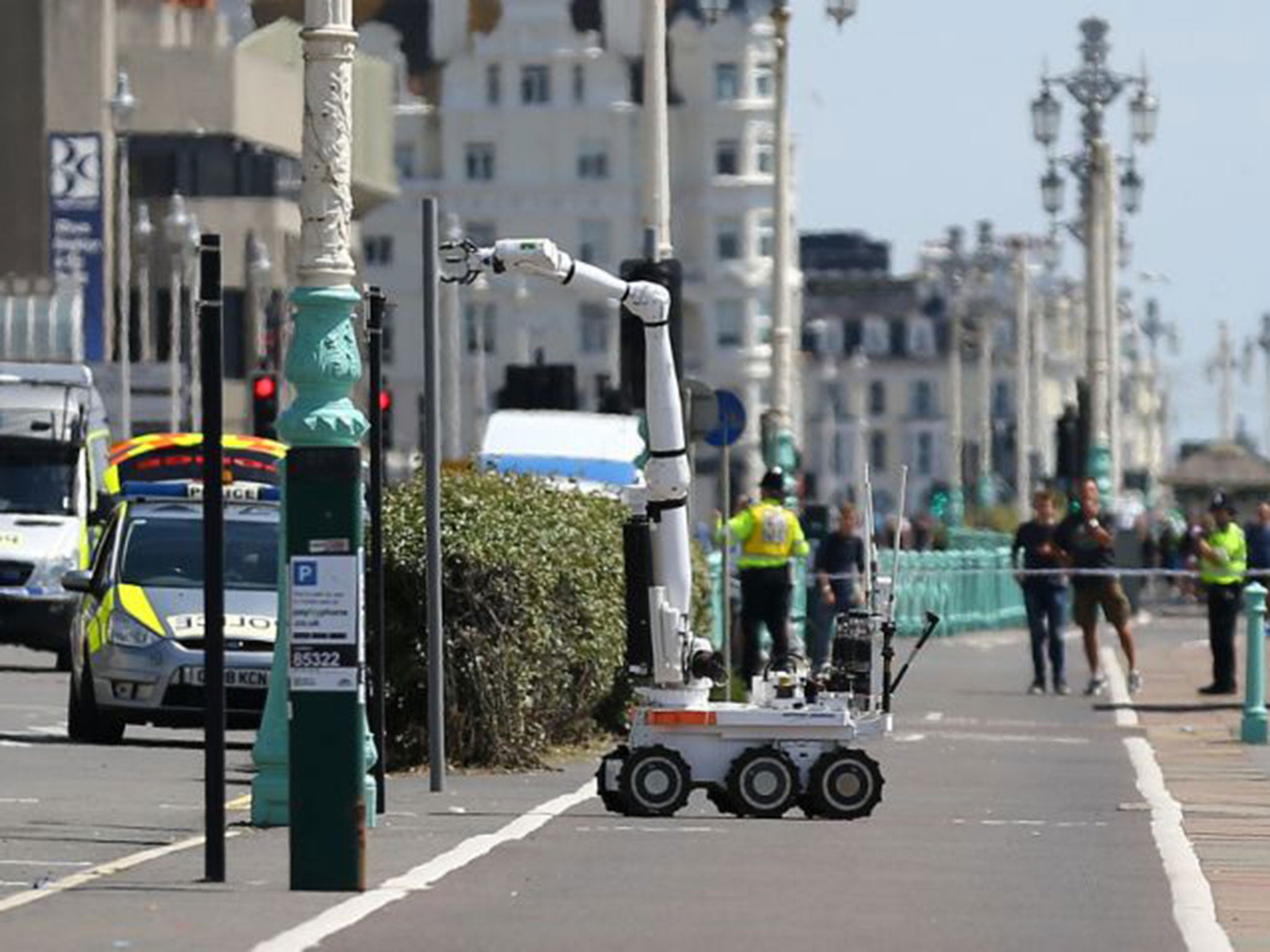 Bomb disposal robot investigates the scene in Brighton, Sussex, after a suspect package was found before the annual Brighton Pride parade