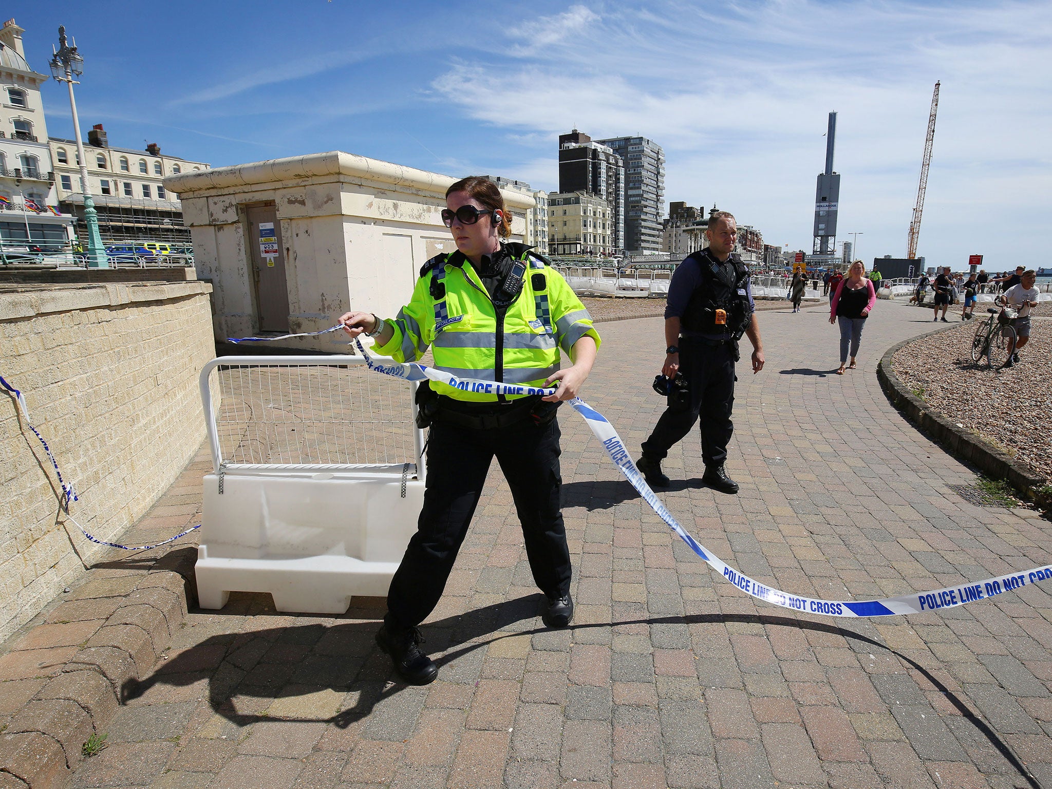 Police officer cordon off the scene in Brighton, Sussex, after a suspect package was found before the annual Brighton Pride parade