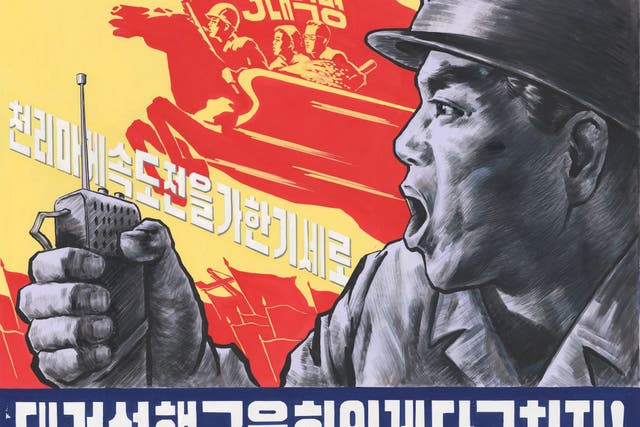 One of the Pyongyang posters, the slogan of which reads:  ‘Let the exploits of the northern railway conductors shine!’