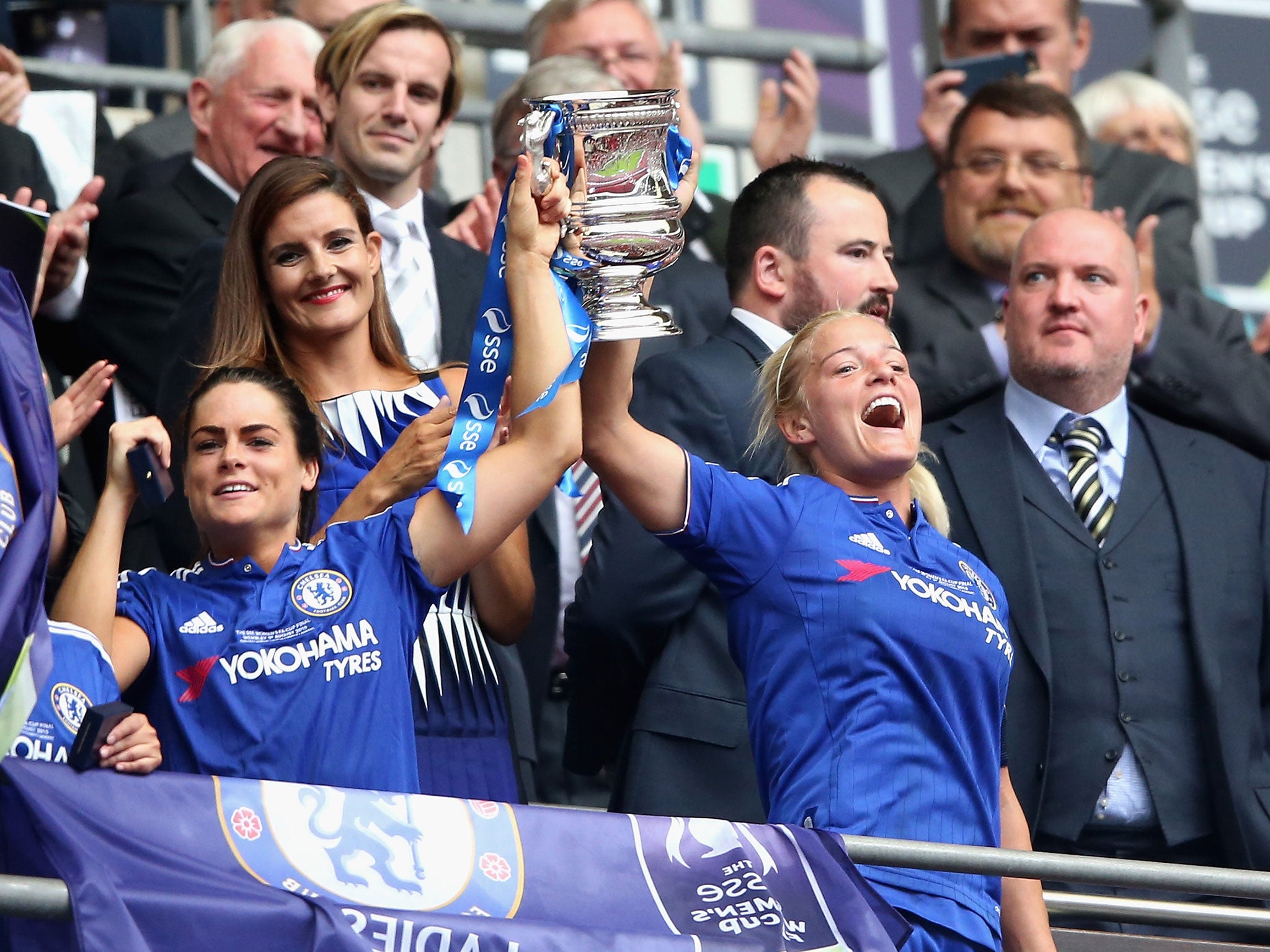 Chelsea players Claire Rafferty and Katie Chapman raise the FA Cup