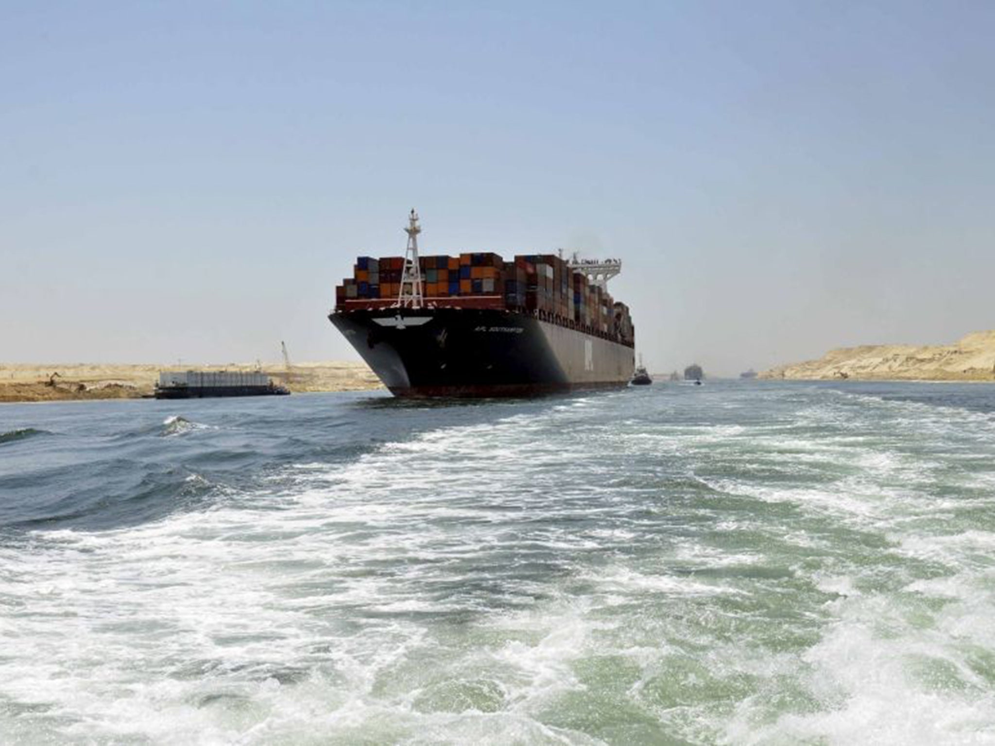 A container ship in the new Suez Canal, due to be officially opened this week