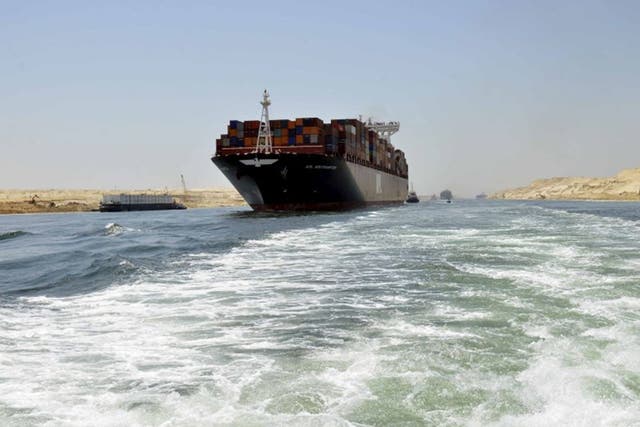 A container ship in the new Suez Canal, due to be officially opened this week
