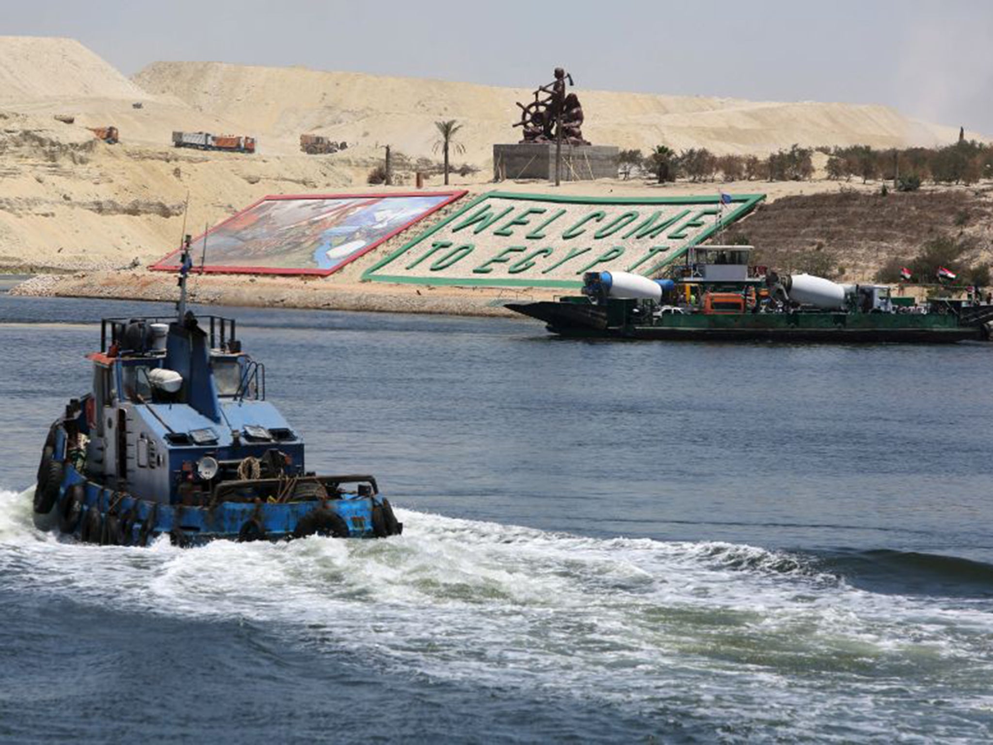 Visual reminders of the canal's strategic importance to Egypt are not in short supply. One bank has been taken up with a large sign saying “Welcome to Egypt” (Re