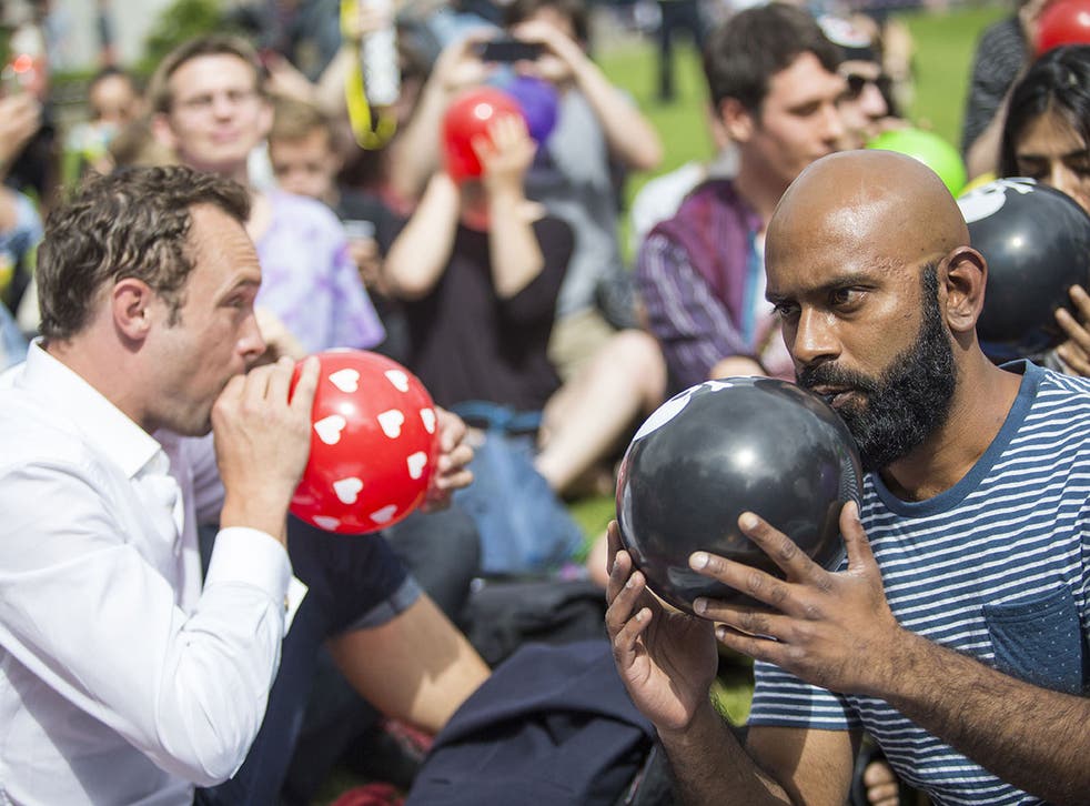 Demonstrators staged a protest against the governments proposed Psychoactive Substances Bill by inhaling laughing gas from balloons outside Parliament on 1 August