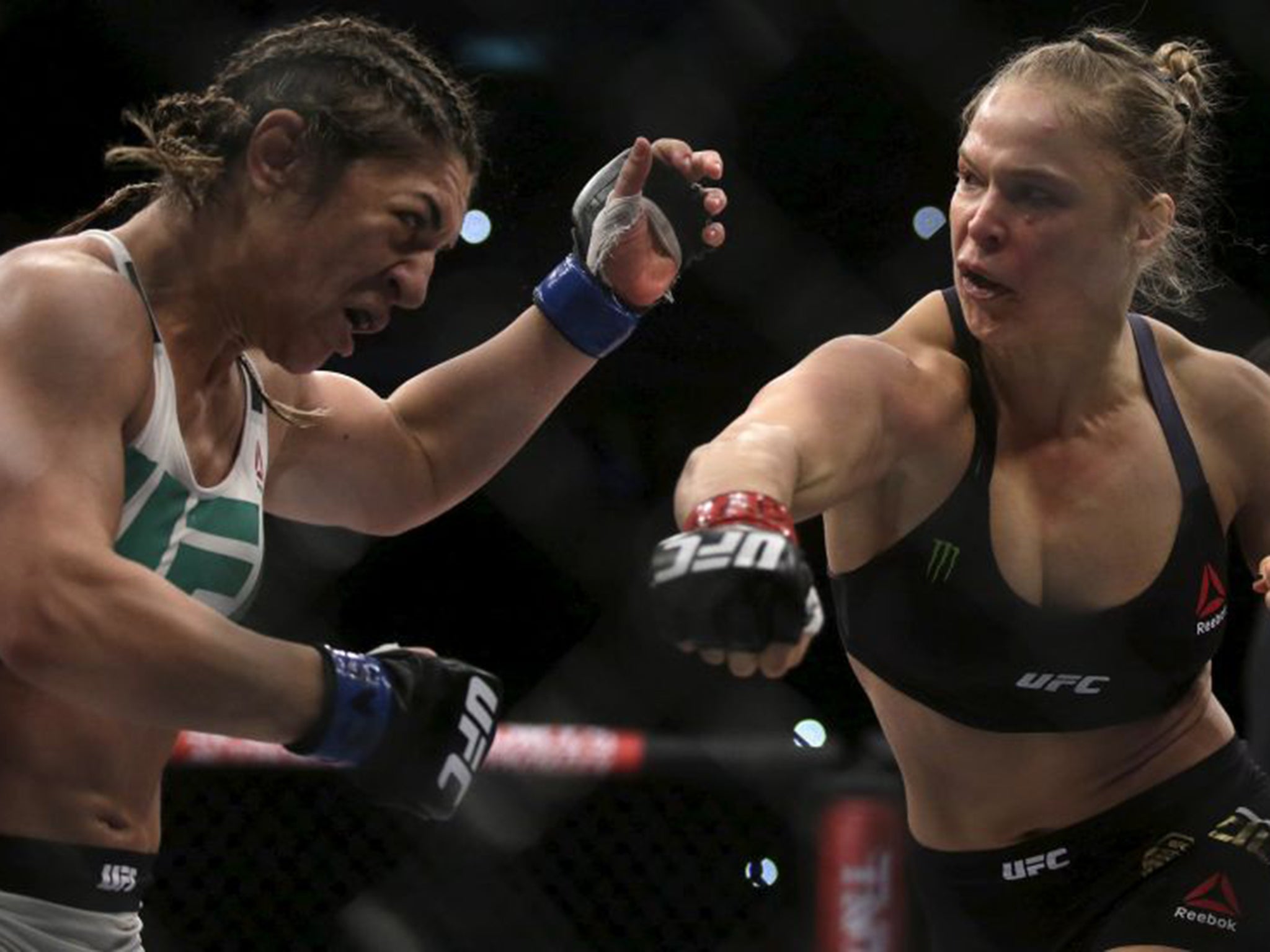 &#13;
Ronda Rousey (right) on her way to beating Bethe Correia in their title fight in August&#13;