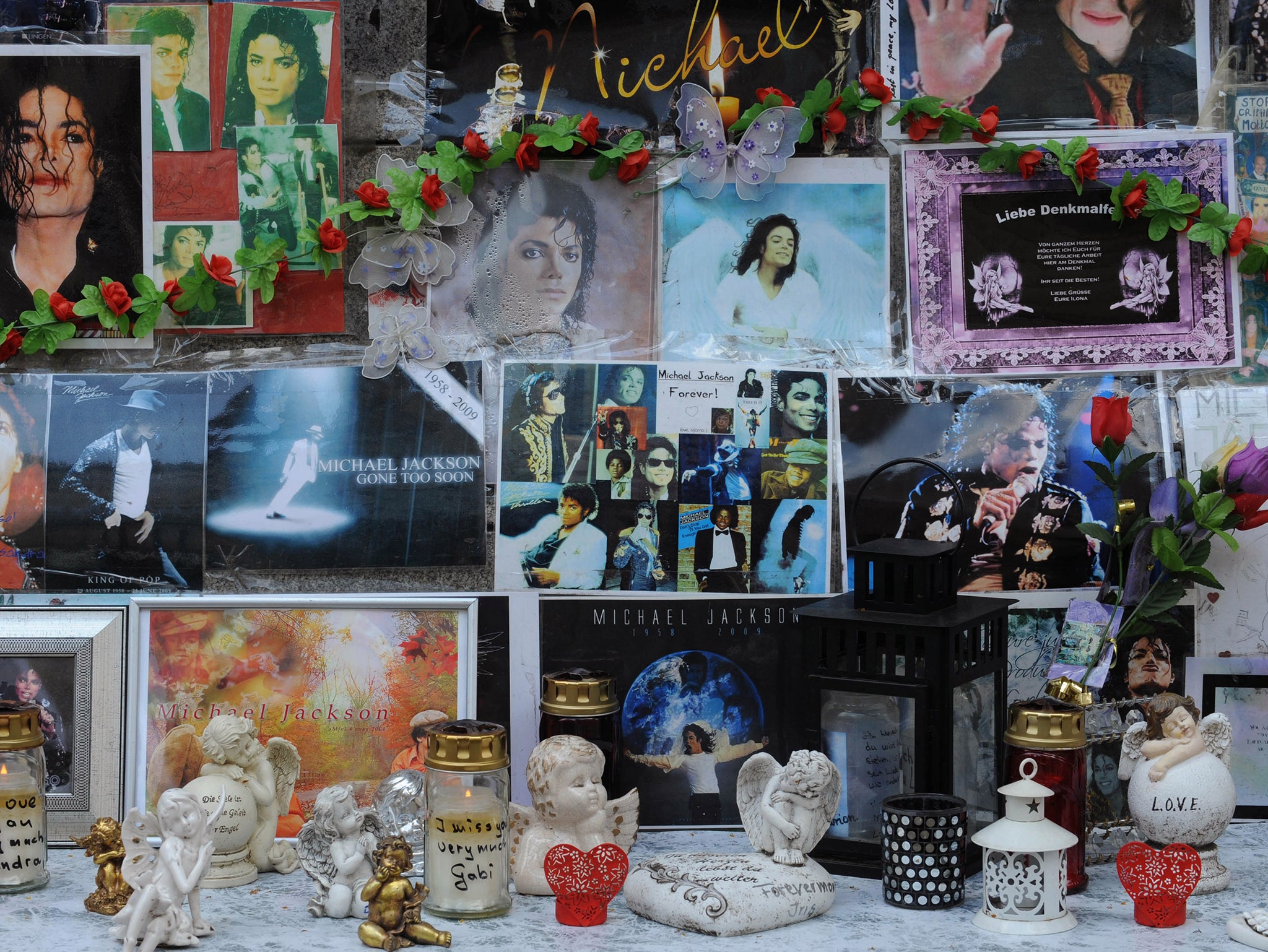 Flowers, candles and personal notes for the King of Pop Michael Jackson are laid down on a monument dedicated to Franco-Flemish Renaissance composer Orlando di Lasso in Munich