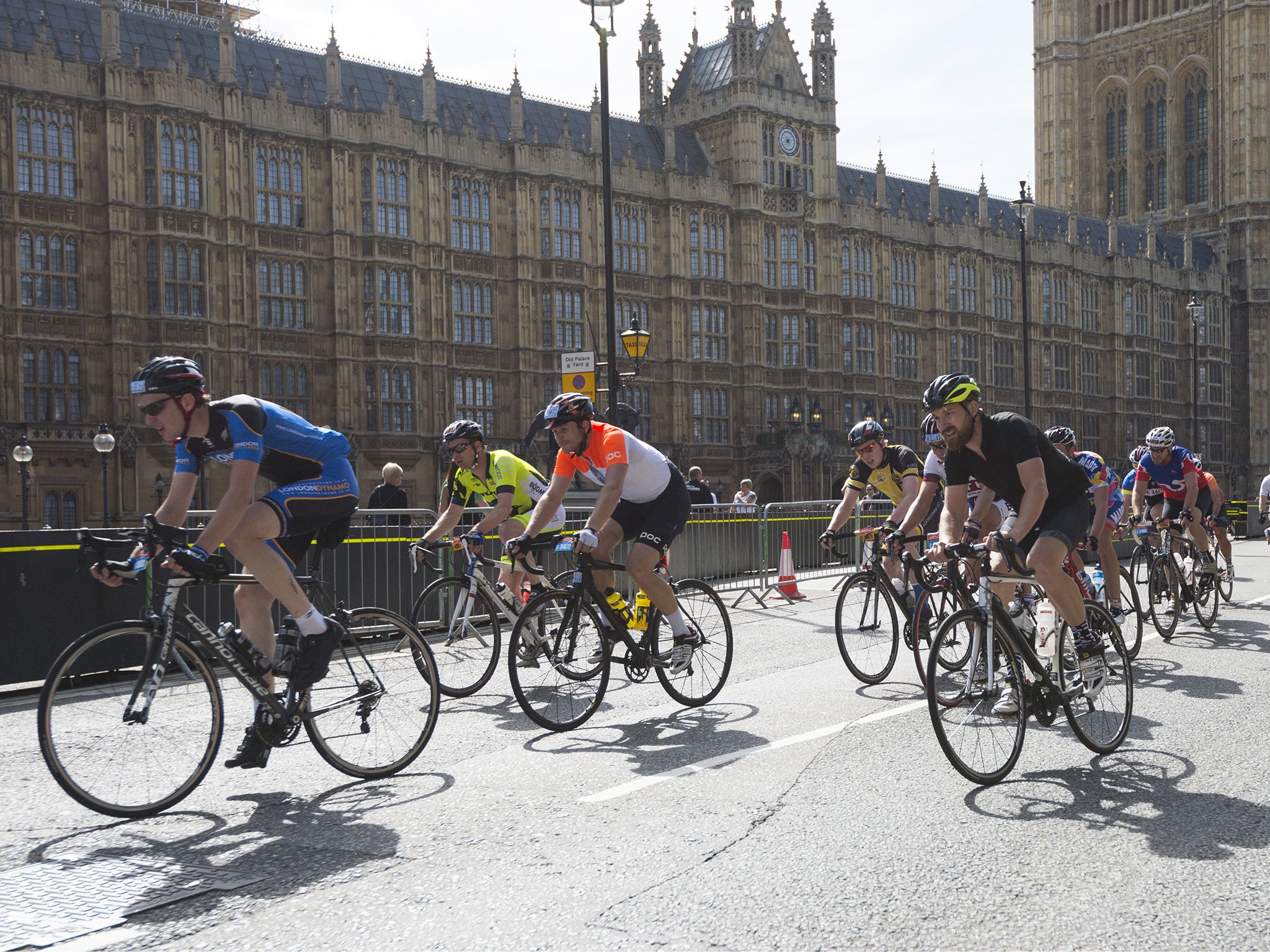 Riders pass the Houses of Parliament during this year's race