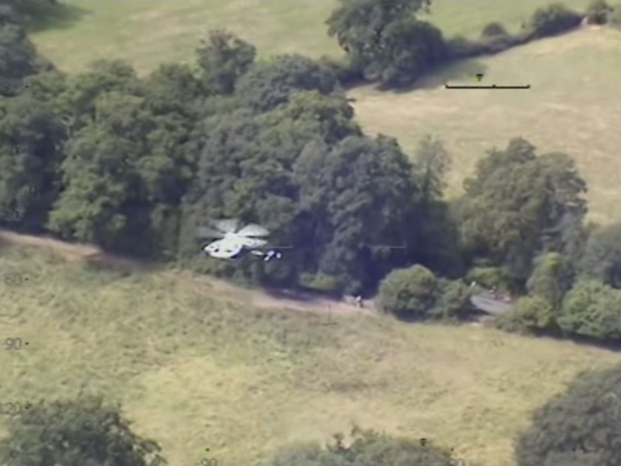 A screen grab showing an air ambulance landing on Leith Hill to treat the cyclist