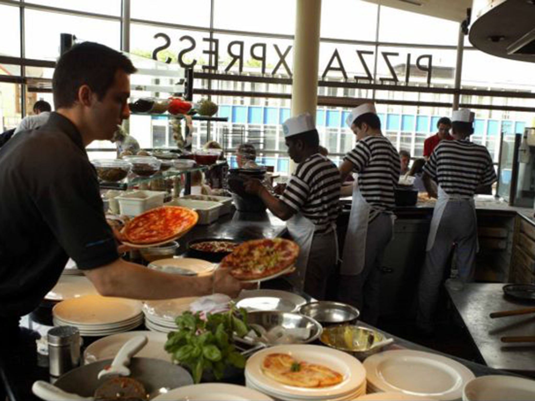 Pizza Express drops 8% charge on staff tips | The Independent | The  Independent