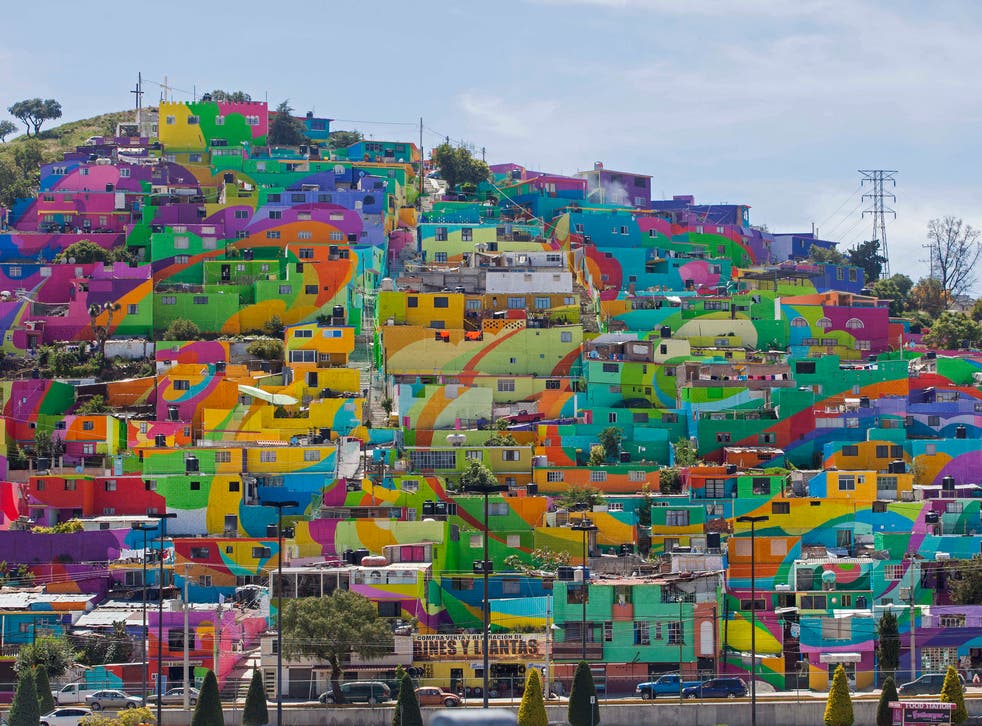 The finished mural on the walls of the hillside Las Palmitas in Pachuca, Mexico