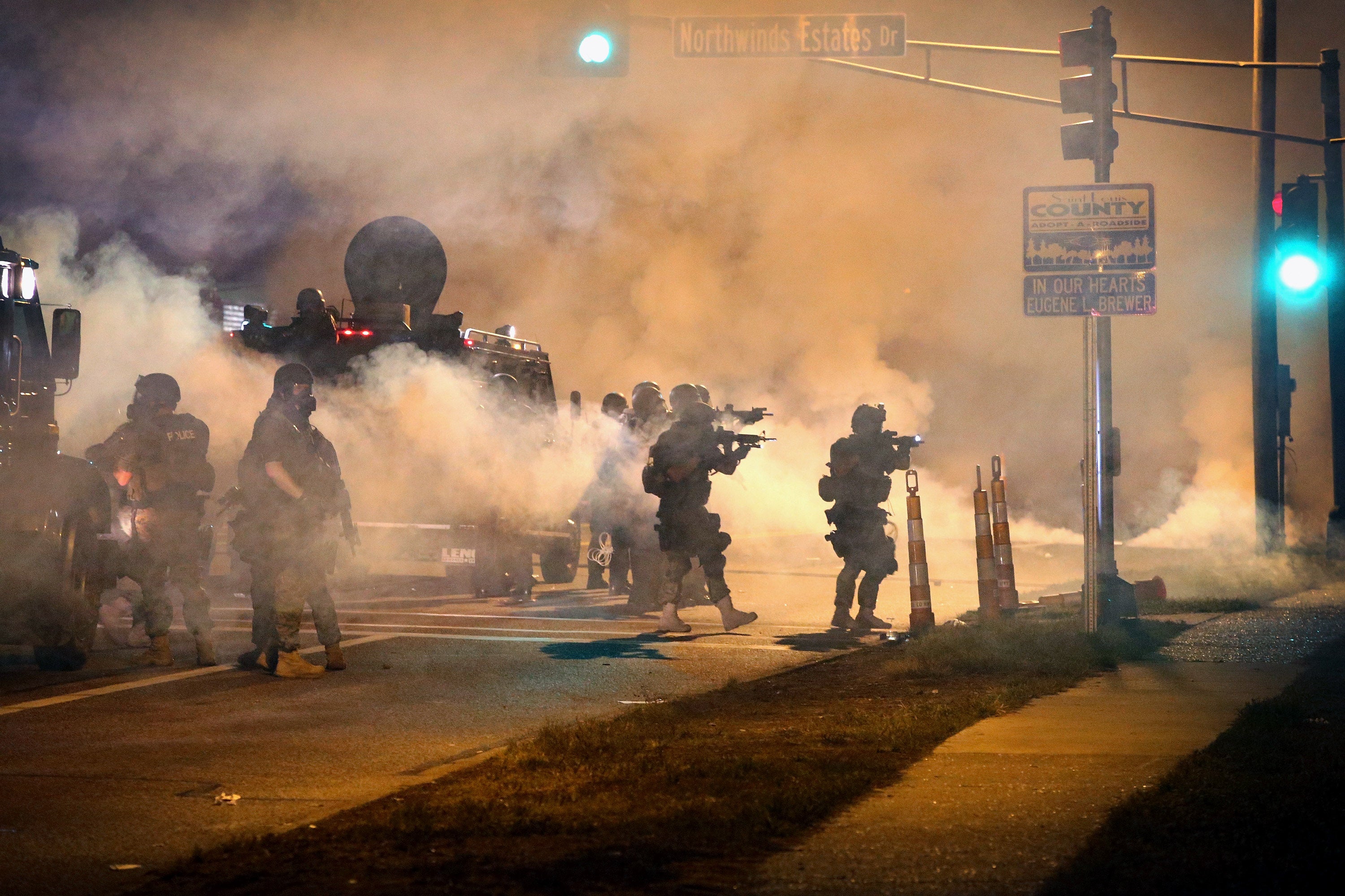 Police attempt to control protesters on 18 August 2014 in Ferguson, Missouri.