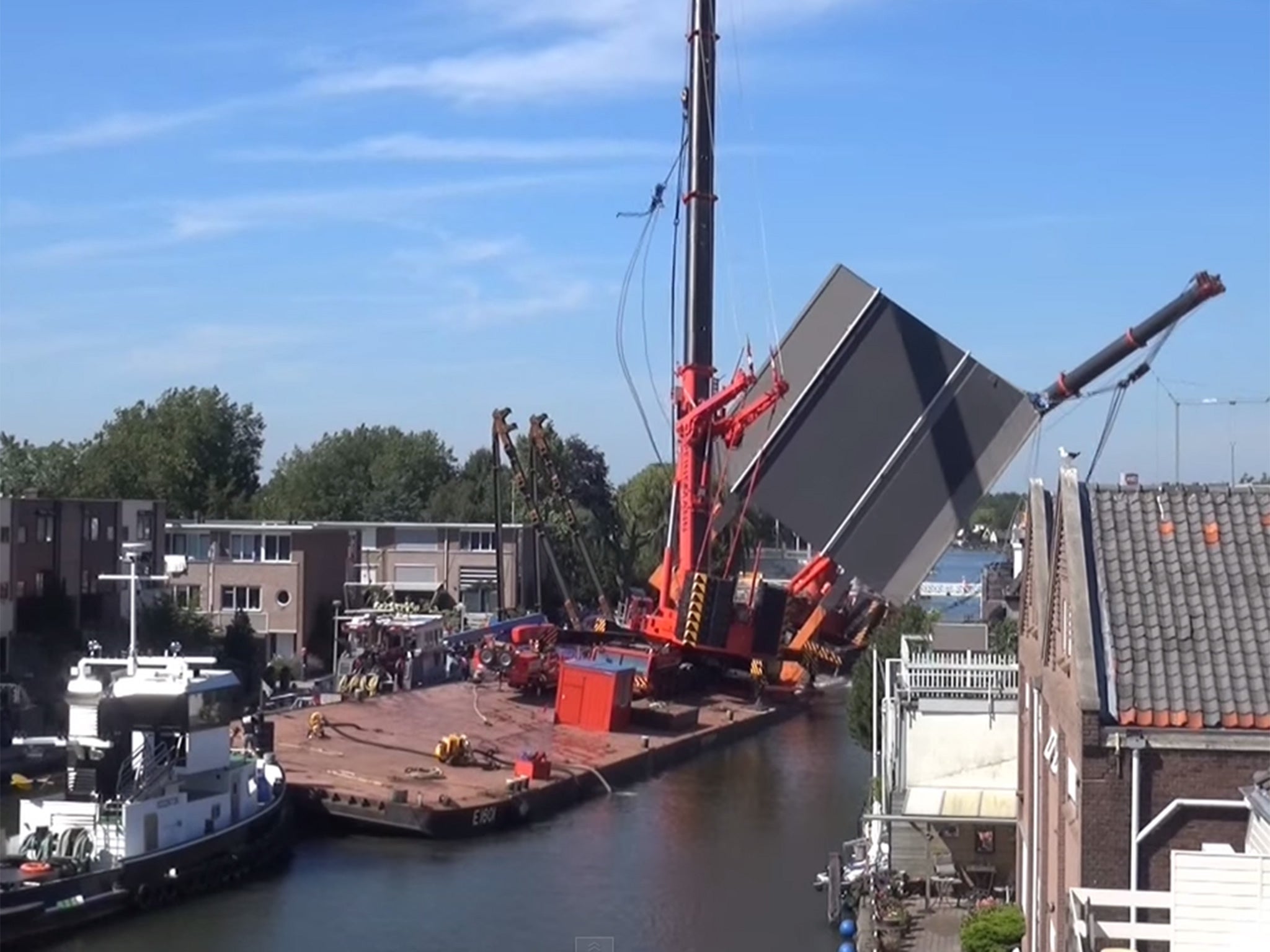 The cranes falling onto buildings in a Dutch city