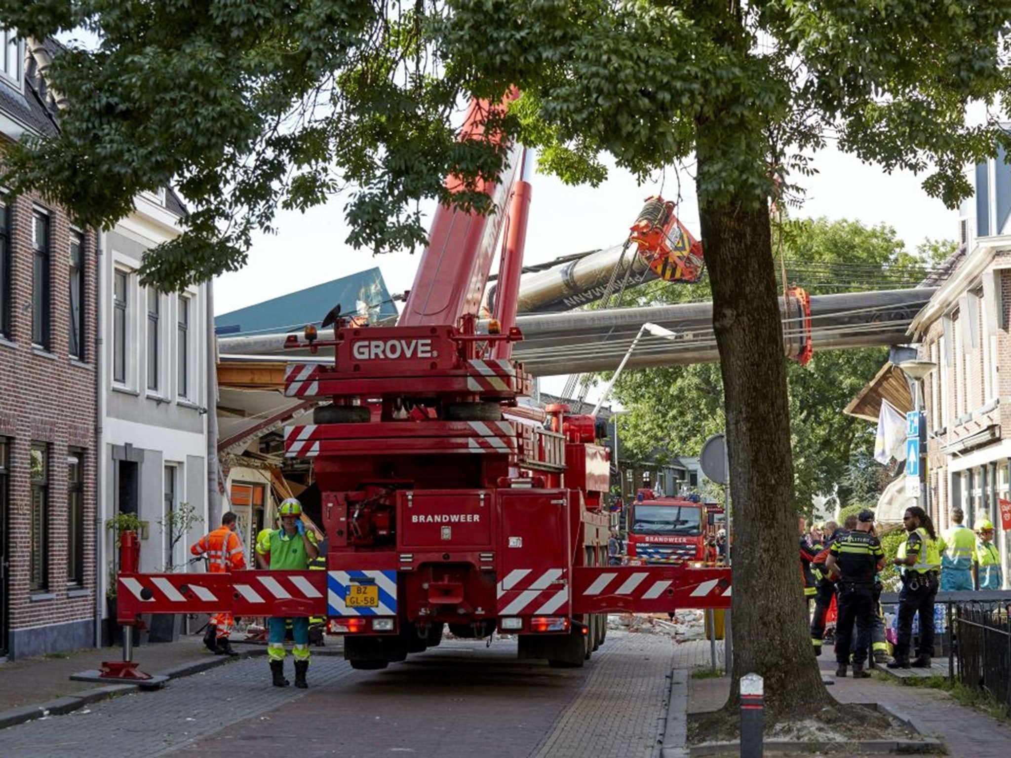 Two cranes that have fallen onto houses in Alphen aan den Rijn.