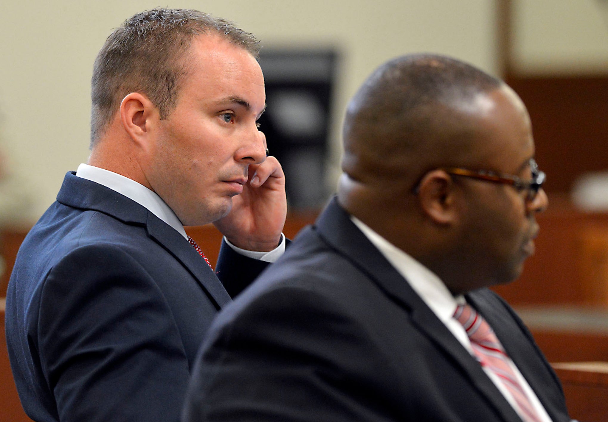 Randall Kerrick, left, and his attorney Michael Greene listen to opening arguments at the Mecklenburg County Courthouse in Charlotte, North Carolina.