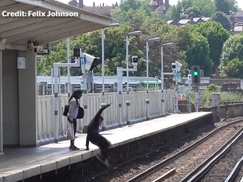 Shocking mobile footage shows a man leaping onto the railway tracks at Peckham Rye station to recover mobile phone