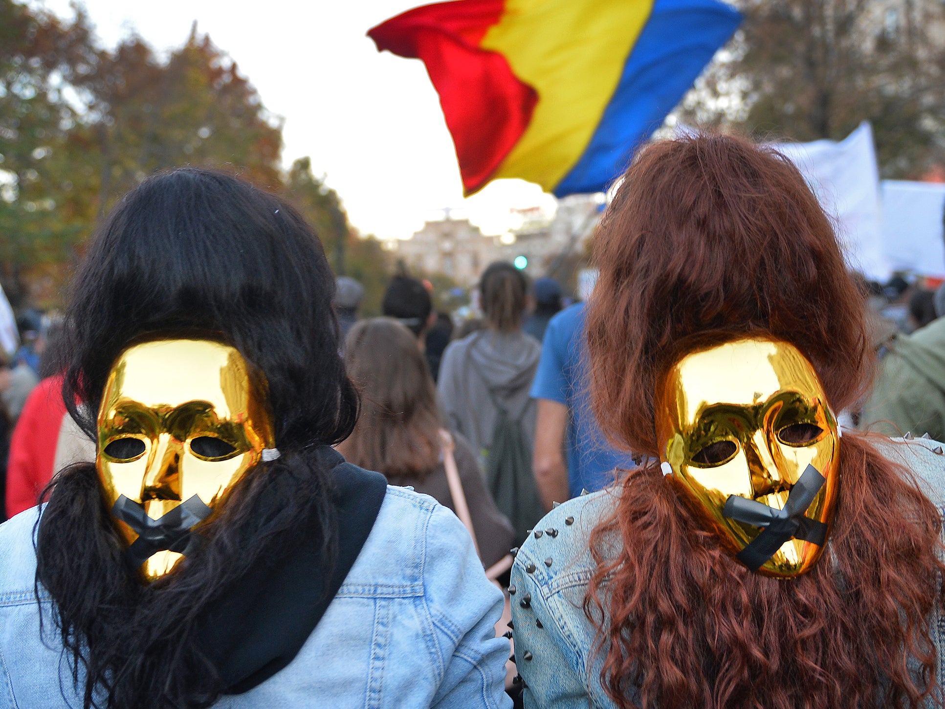 People wear golden masks during a protest in Bucharest against the Gabriel Resources gold mine in 2013