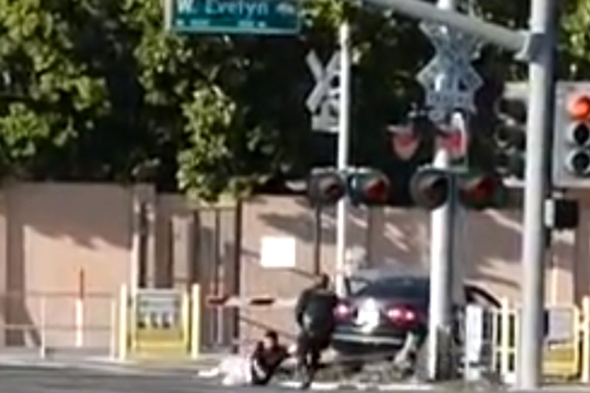Police officer drags driver to safety moments before vehicle is struck ...
