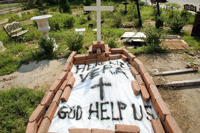 A makeshift grave is seen for a woman on a downtown street in New Orleans, Louisiana, 2005