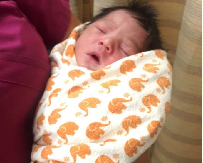 The newborn was found on Tuesday afternoon having been there since Monday night