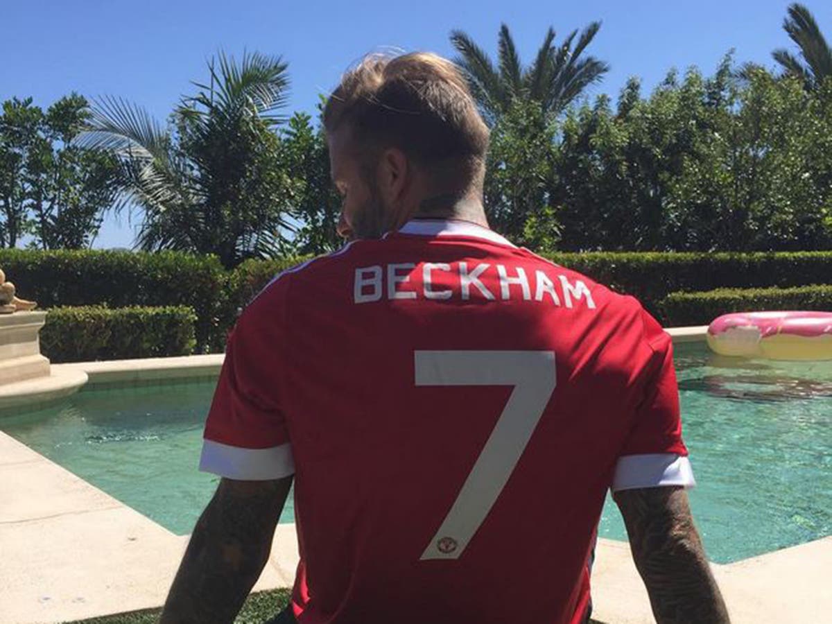 David Beckham pictured in the new Manchester United home kit with