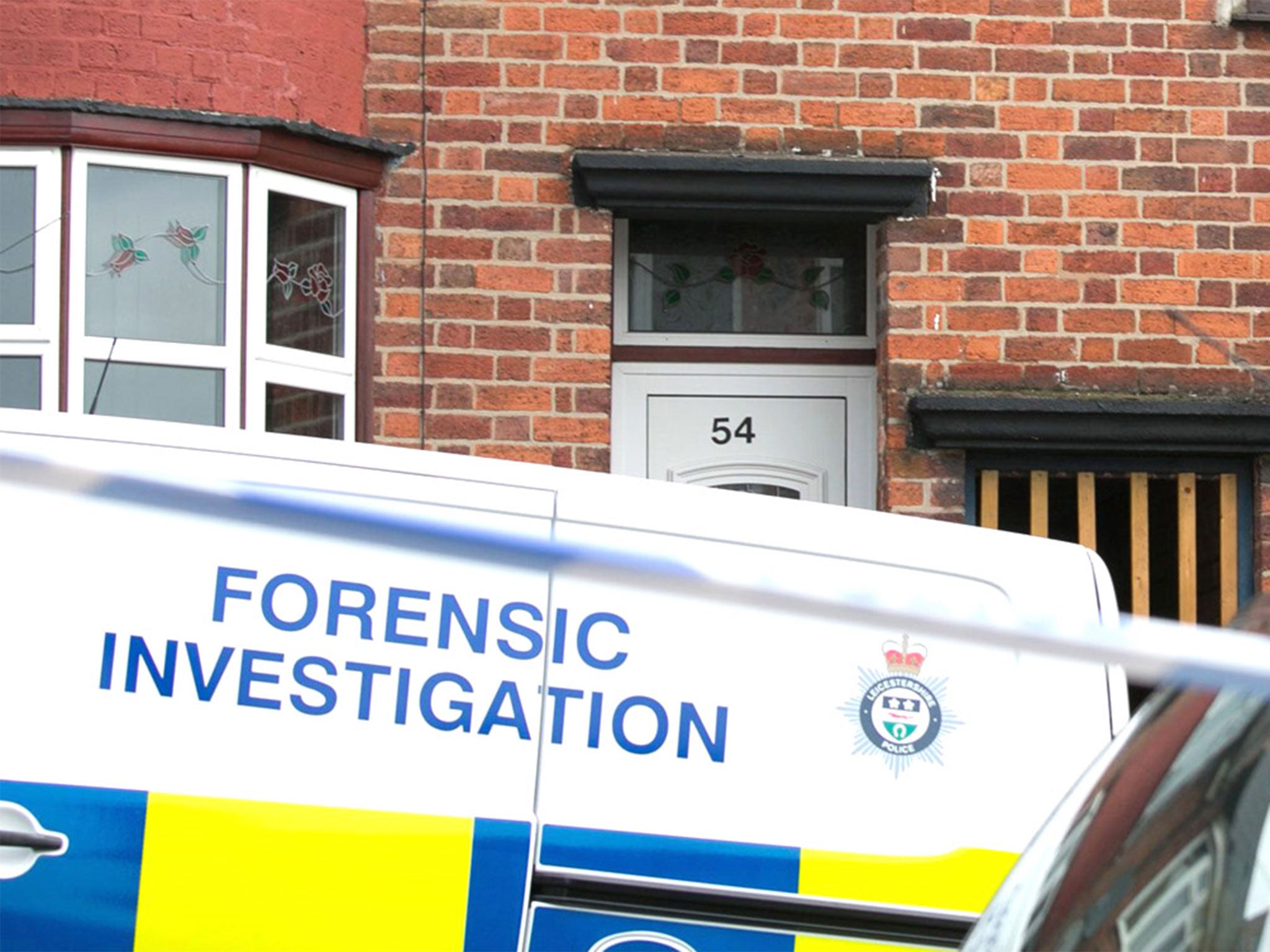 A forenic investigations van outside an even-numbered house in Leicester
