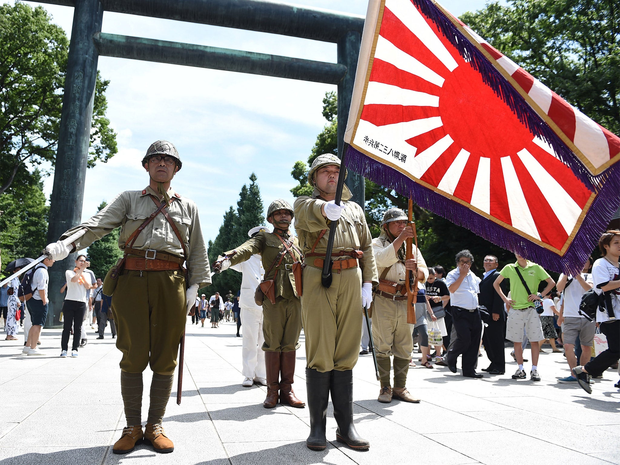 Men dressed in Second World War Japanese military uniform at the Yasukuni Shrine during the annual?commemoration of Japan’蝉 surrender?(Getty)